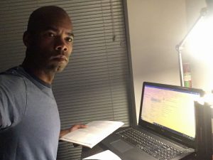 Writer at desk early in morning to get momentum going